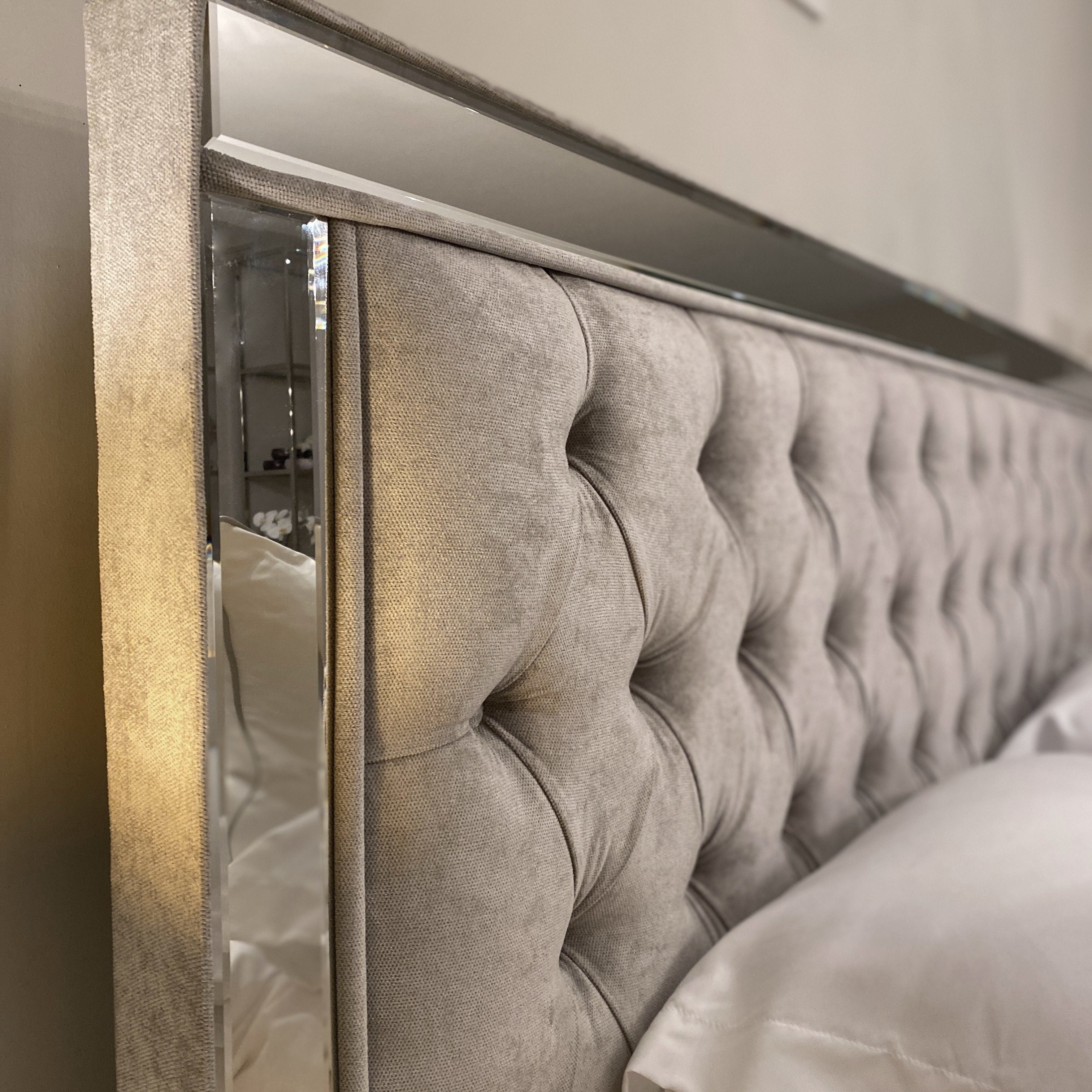 Grey bed store with mirror headboard