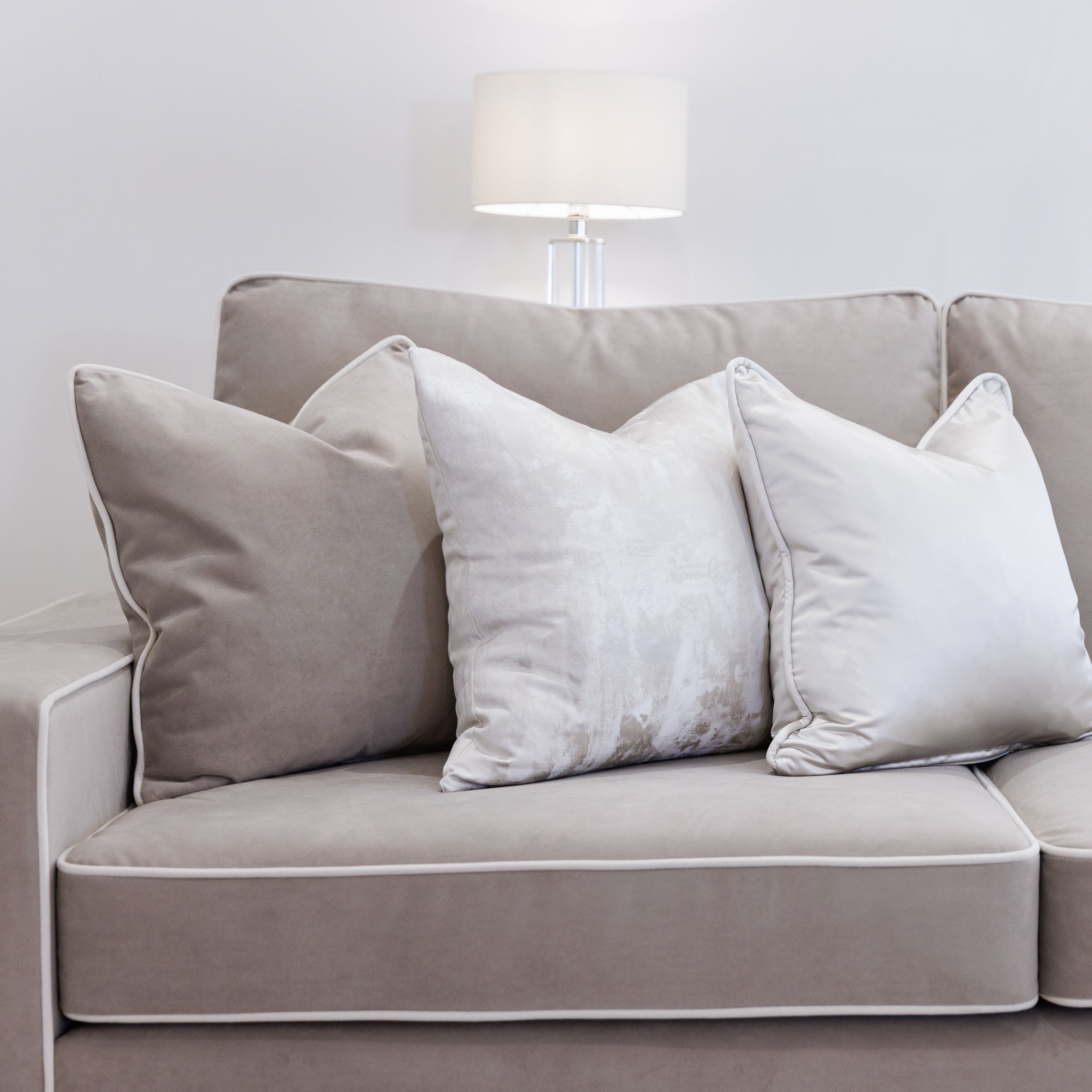 Gray sofa with white outlet piping